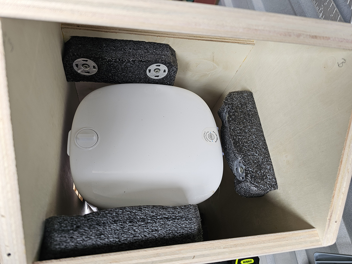 Foam padding installed inside Cat Cabin for feeder stability